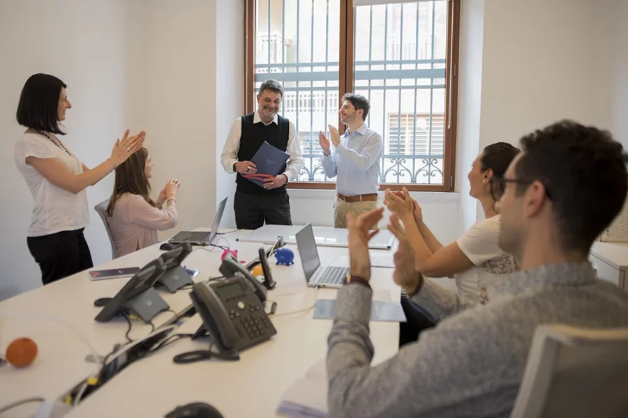 Team applauding in a meeting room